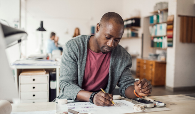 A man sitting at his workspace 