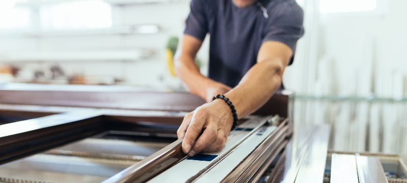 A craftsman working with some wood.